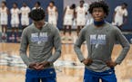 Minneapolis North players Zaeshon Rich, left, and Willie Wilson stood for the national anthem before the George Floyd Memorial Holiday Classic.