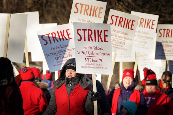 In this file photo, St. Paul teachers picket outside Adams Spanish Immersion School at the start of what would be a three-day strike in March 2020.