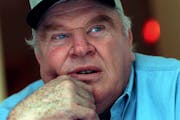 John Madden wore a hat in 1999 he received while visiting his birthplace of Austin, Minn.