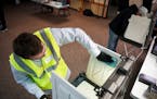 Wisconsin National Guardsman Max Sykes disinfected voting booths after every use during the primary election in April 2020.