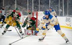Wild goaltender Cam Talbot watches as St. Louis Blues center Jordan Kyrou controls the puck in front of the net in the second period of the 2022 Winte
