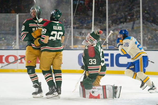 The Wild’s Jordan Greenway (left) and Dmitry Kulikov (29) arrived too late to help Wild goalie Cam Talbot stop one of the Blues’ five second-perio