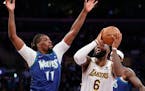 Los Angeles Lakers forward LeBron James (6) drives to the basket against Minnesota Timberwolves center Naz Reid (11).