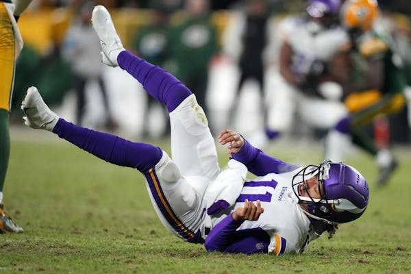 Vikings rookie quarterback Kellen Mond made his NFL debut Sunday night in the fourth quarter. He was hit hard by Packers linebacker Rashan Gary.