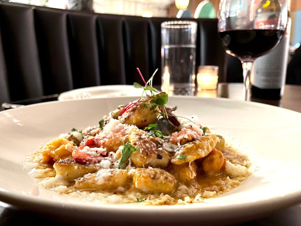 Gnocchi are served with big hunks of lobster meat in a sauce tinged with truffle oil.