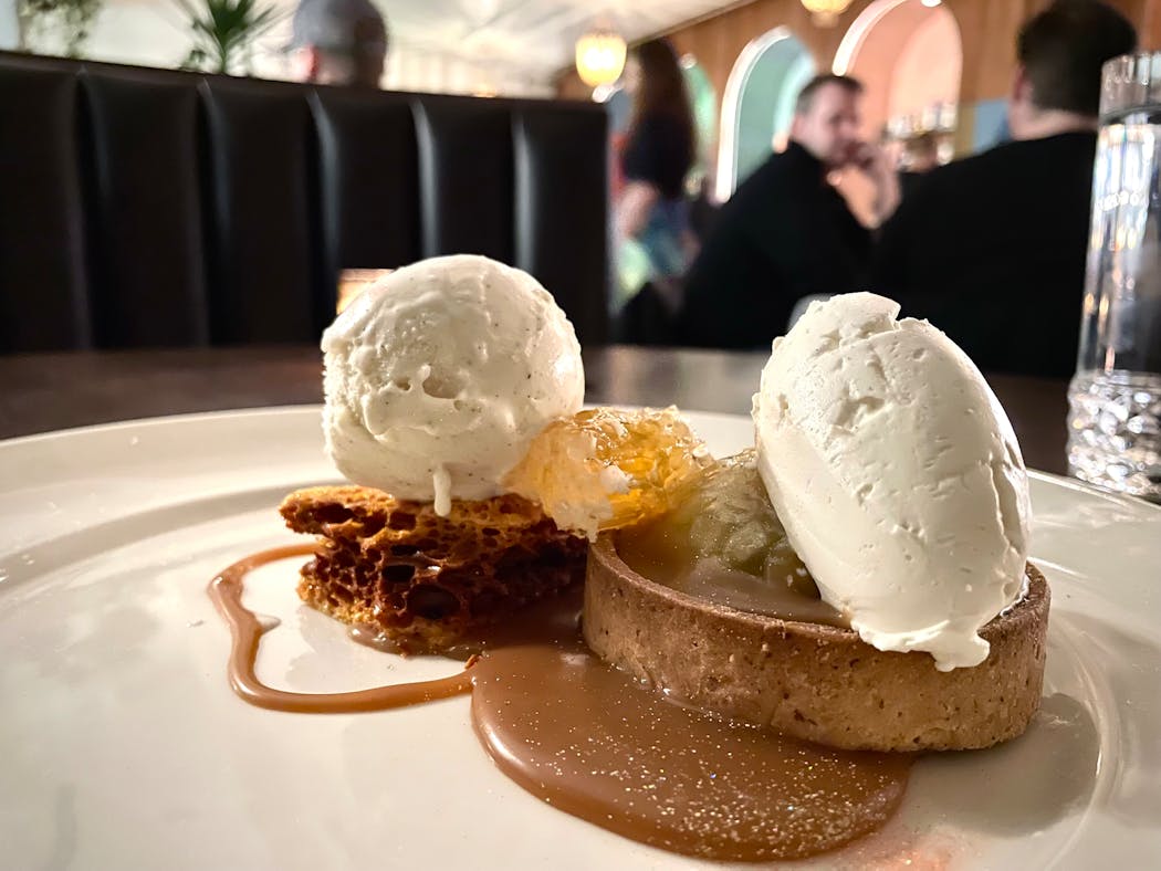 A tart served with caramel sauce, homemade ice cream and honeycomb candy from pastry chef Scott Shelby.