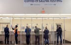 People used the saliva COVID-19 testing site at Minneapolis-St. Paul International Airport on Nov. 20, 2020. 