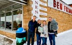 Former Joynes Department Store and Ben Franklin owners Jim and Shanie Joynes stood with new owners Jessica Dean, holding son Asher, and Tyler Dean, ho