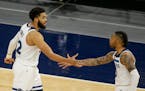 Wolves coach Chris Finch is hopeful center Karl-Anthony Towns (left) and guard D’Angelo Russell will be able to play at Target Center on Wednesday a