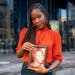 Nubia Monks with a photo of her grandmother Annie Marie Hawk, to whom she’s dedicating her performance in the Guthrie Theater’s “A Raisin in the