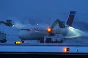 Planes at MSP Airport underwent de-icing during a snowstorm last month.