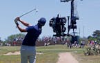 Andrew Landry tees off in front of a TV camera at the seventh hole during the final round at the Valero Texas Open in 2018