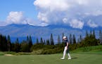 Patrick Cantlay lines up his shot on the ninth green during the Tournament of Champions pro-am at Kapalua Plantation Course in Kapalua, Hawaii