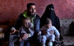 Ziad Khaled Hilweh, 23, who tried to migrate to Europe with his family, spoke during an interview as he sat with his wife, Alaa Khodr, 22; his daughte