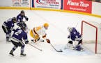 Gophers forward Jaxon Nelson took a shot against St. Thomas goalie Jacob Berger in last Sunday’s exhibition victory at Doug Woog Arena in South St. 