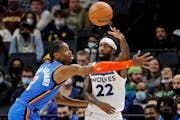 Timberwolves guard Patrick Beverley passes the ball over Oklahoma City guard Shai Gilgeous-Alexander on Wednesday