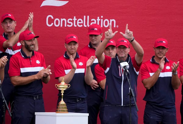 USA captain Steve Stricker holds up a “W” for Wisconsin at the closing ceremony after the Ryder Cup matches at Whistling Straits 