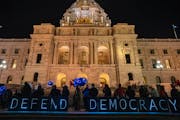 Supporters of the Spotlight on Democracy rallied Thursday night on the steps of the State Capitol in St. Paul.