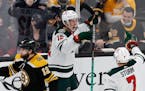 Matt Boldy prepared to celebrate his first NHL goal with teammate Nico Sturm in the second period of the Wild’s 3-2 victory in Boston on Thursday. B