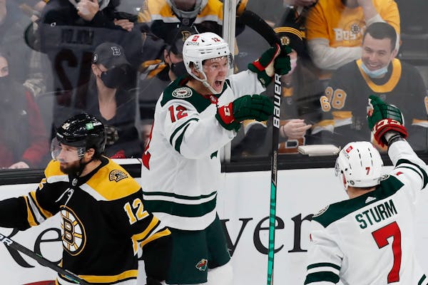 Matt Boldy prepared to celebrate his first NHL goal with teammate Nico Sturm in the second period of the Wild’s 3-2 victory in Boston on Thursday. B