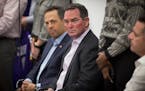 Vikings coach Mike Zimmer and co-owner Mark Wilf, left, listened to Kirk Cousins speak during a press conference announcing his signing on March 15, 2