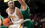 Eric Curry (1) of Minnesota plays against Green Bay on Dec. 22, 2021 at Williams Arena.