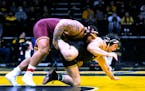 Gophers heavyweight Gable Steveson, left, beat Iowa’s Tony Cassioppi 17-7 on Friday. Steveson is 70-2 as a college wrestler.