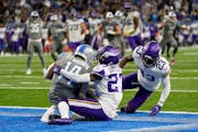 Lions rookie Amon-Ra St. Brown caught an 11-yard TD pass on the final play of the game to beat the Vikings on Dec. 5, as defensive backs Cameron Dantz
