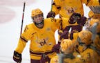Gophers forward Ella Huber (26), above celebrating a goal vs. St. Thomas last season, had two goals Saturday in a 4-3 loss to Yale.
