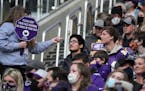 A U.S. Bank Stadium worker reminded fans to wear their face masks in the first quarter of the Vikings-Bears game Sunday.