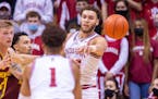 Indiana forward Race Thompson passes the ball teammate guard Rob Phinisee during the first half Sunday.