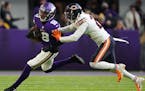 Minnesota Vikings wide receiver Justin Jefferson (18) was tackled by Chicago Bears safety Deon Bush (26) in the fourth quarter.