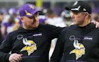Vikings coach Mike Zimmer, right, with his son Adam, the team’s co-defensive coordinator, after Sunday’s 31-17 victory over the Bears.