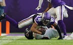 Vikings wide receiver Justin Jefferson was brought down after catching a pass from Kirk Cousins in the second quarter Sunday.