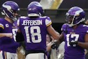 Minnesota Vikings wide receiver K.J. Osborn (17) celebrated a touchdown with quarterback Kirk Cousins (8) and wide receiver Justin Jefferson (18) in t