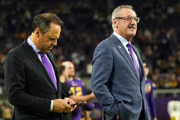 Mark Wilf, left, and Zygi Wilf, co-owners of the Minnesota Vikings, watched warm-ups from the sidelines before the team’s game against Pittsburgh on