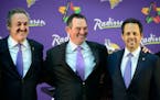  Zygi Wilf, left, and Mark Wilf, right, with Mike Zimmer at Zimmer’s introductory news conference in 2014. 