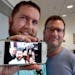 Scott Shive, left, with husband Marc Roland, held up a cell phone photo of their impromptu wedding in Lexington, Ky. On that day in June 26, 2015, a d