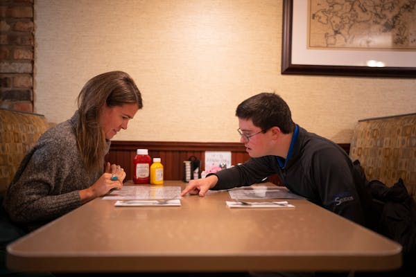 Alison Spencer and her brother, Teddy, looked over the menu at Maggie’s Family Restaurant in Wayzata as part of their quest to find the city’s bes