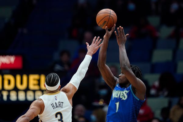 Timberwolves guard Anthony Edwards shot over Pelicans guard Josh Hart (3) in the second half Tuesday.