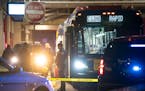 Minneapolis police investigate the scene on a Metro Transit bus where two people were shot in February 2020.