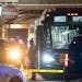Minneapolis police investigate the scene on a Metro Transit bus where two people were shot in February 2020.