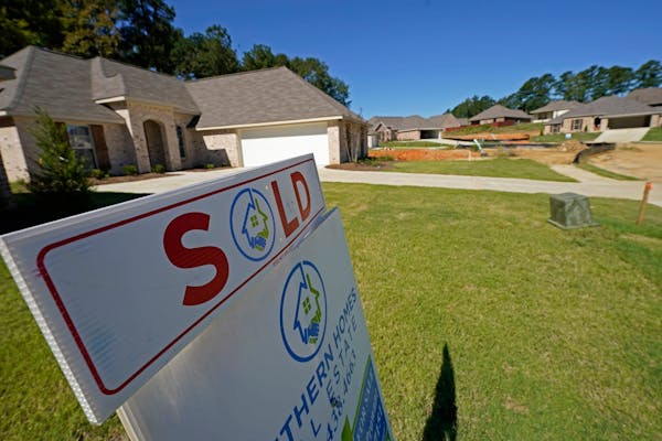 A “Sold” sign on the lawn of a new house in Pearl, Miss.