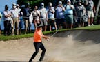 Kevin Na hits out of the 11th bunker during the first round of the Sony Open 