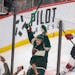 Minnesota Wild left wing Kirill Kaprizov (97) celebrates a goal as New Jersey Devils center Michael McLeod (20) skates away during the first period of