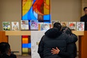 Mourners pay their respects during the Hernandez-Pinto family funeral services at Lutheran Church of the Good Shepherd in Moorhead, Minn., on Friday.