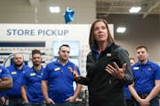 Best Buy CEO Corie Barry, in a 2019 file photo with store employees