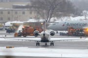 In 2019, snow removal equipment operated on a runway at Minneapolis St. Paul International Airport.
