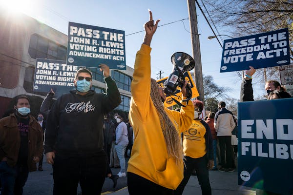 Demonstrators supported voting rights outside of Clark Atlanta University in Atlanta on Jan. 11, 2022, ahead of a planned speech by President Joe Bide
