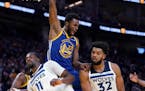 A fired-up Andrew Wiggins dunked against Karl-Anthony Towns and the Wolves the first time they played Golden State this season. Wiggins scored a team-